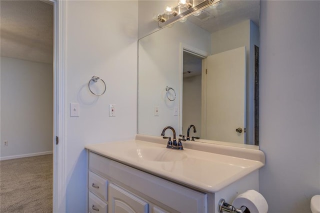 bathroom with vanity and a textured ceiling