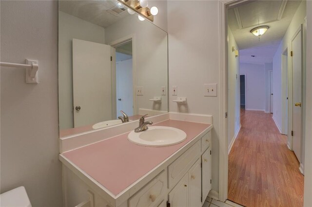 bathroom with vanity and wood-type flooring