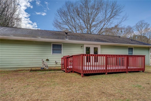 back of property featuring a yard and a deck