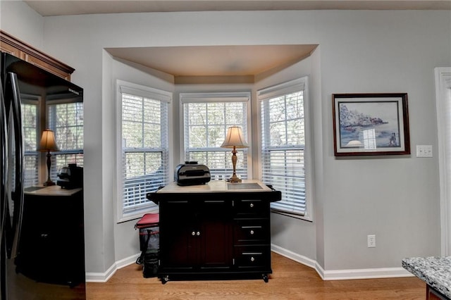 entryway featuring light hardwood / wood-style flooring and crown molding