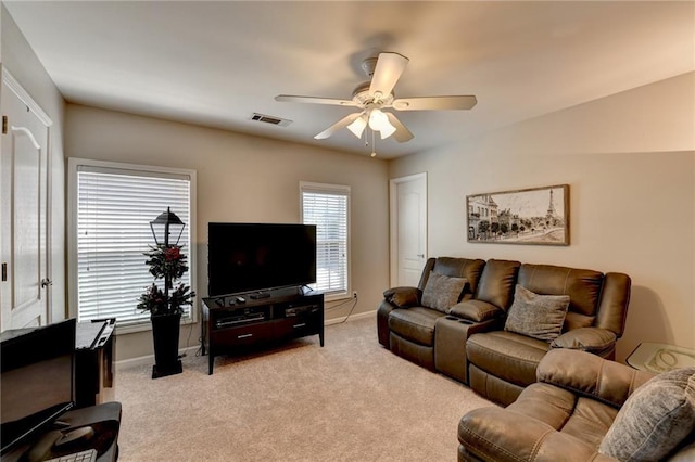 carpeted living room featuring ceiling fan