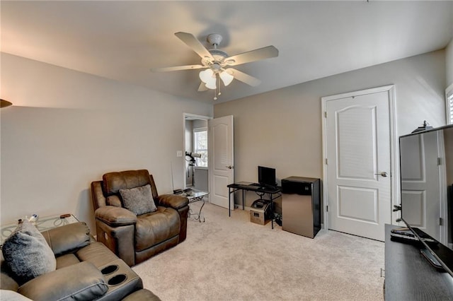 living room with light colored carpet and ceiling fan