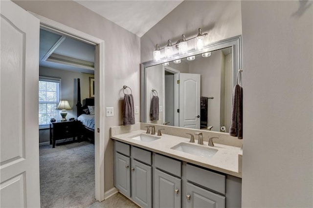 bathroom featuring vanity and vaulted ceiling