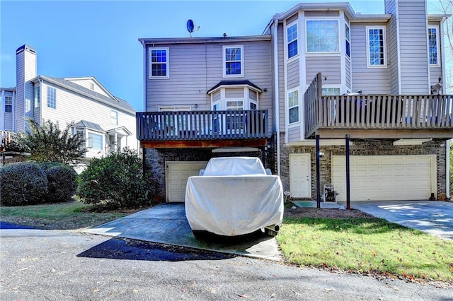 back of property featuring a garage