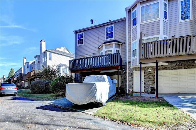 rear view of property with a garage