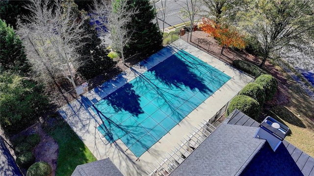 view of swimming pool featuring tennis court