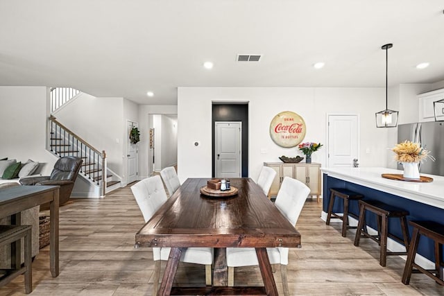 dining room featuring light hardwood / wood-style flooring