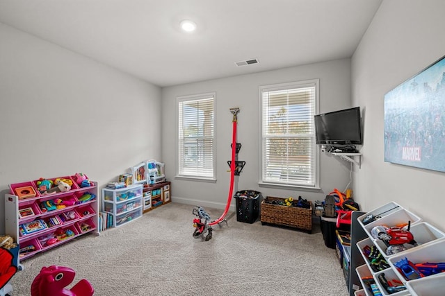 recreation room with carpet flooring