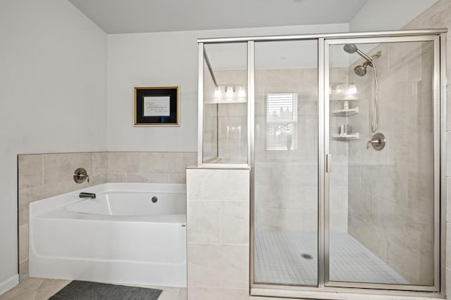 bathroom featuring tile patterned floors and plus walk in shower