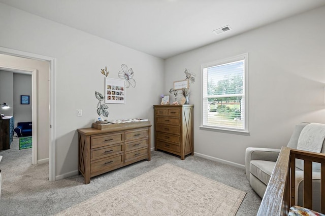 bedroom featuring light colored carpet