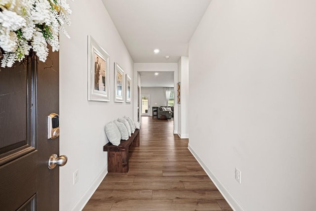 hall with hardwood / wood-style floors