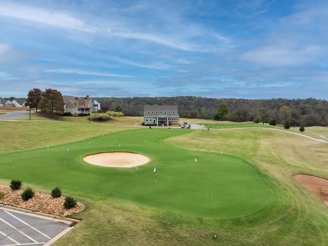 view of property's community featuring a lawn