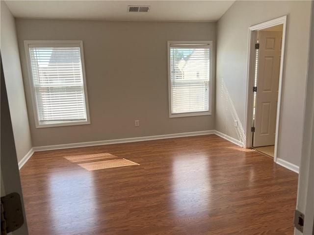 empty room featuring hardwood / wood-style flooring