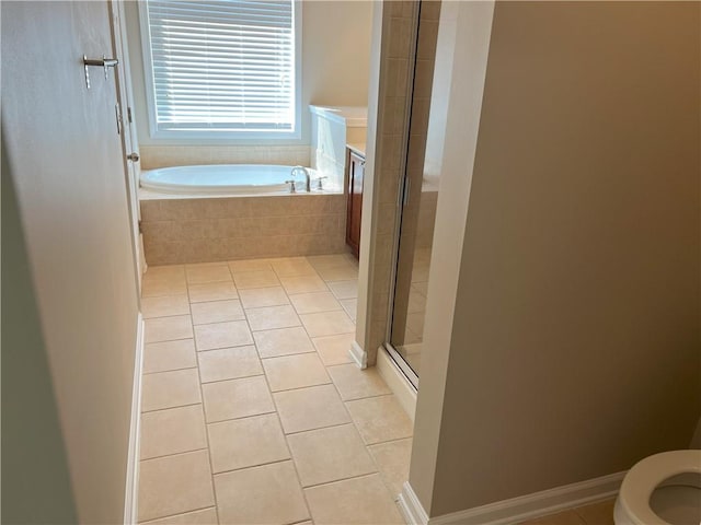 bathroom with toilet, shower with separate bathtub, and tile patterned flooring