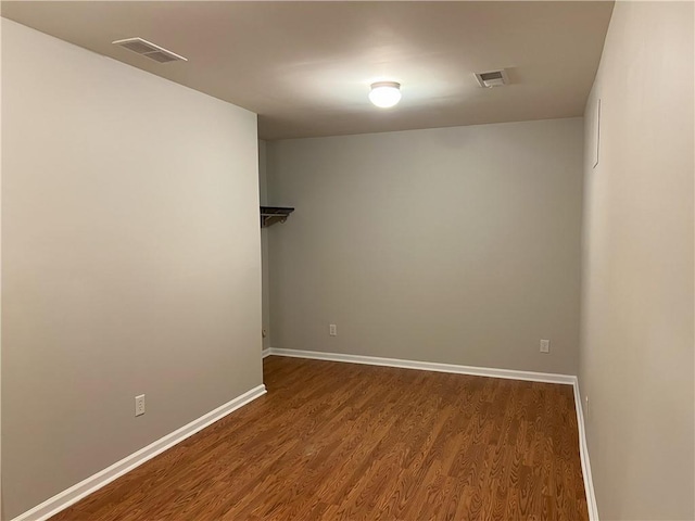 spare room with hardwood / wood-style flooring