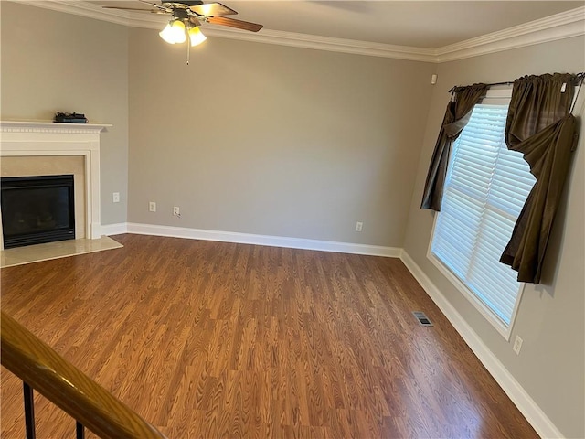 unfurnished living room featuring ornamental molding, hardwood / wood-style floors, and ceiling fan