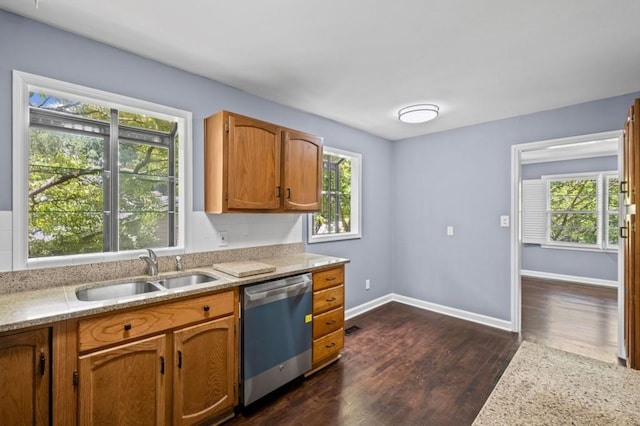 881 Mclinden Ave SE, Smyrna, GA 30080 - kitchen featuring dishwasher, dark wood finished floors, brown cabinetry, and light stone counters