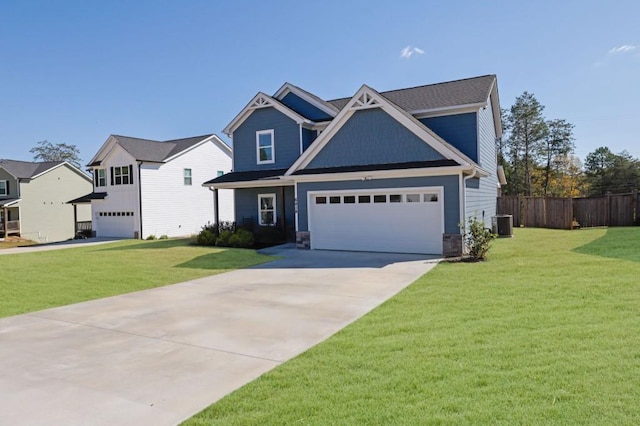 craftsman inspired home featuring a garage, a front lawn, and central AC unit