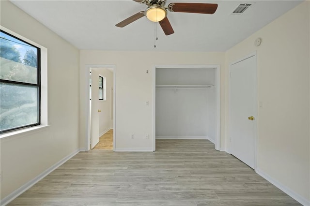 unfurnished bedroom with a closet, ceiling fan, and light hardwood / wood-style flooring