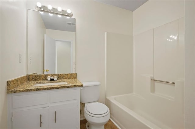 full bathroom with tub / shower combination, vanity, and toilet