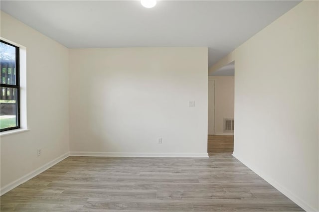 unfurnished room featuring light wood-type flooring