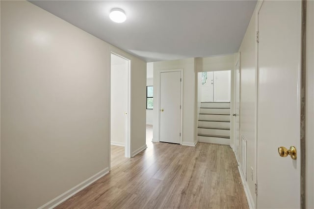 corridor featuring light hardwood / wood-style floors