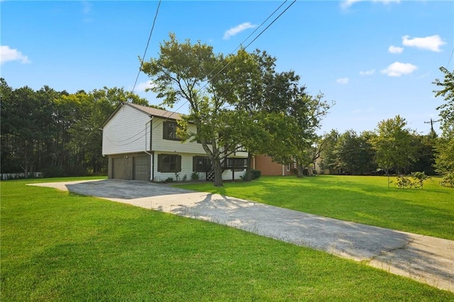 view of front facade featuring a garage and a front lawn