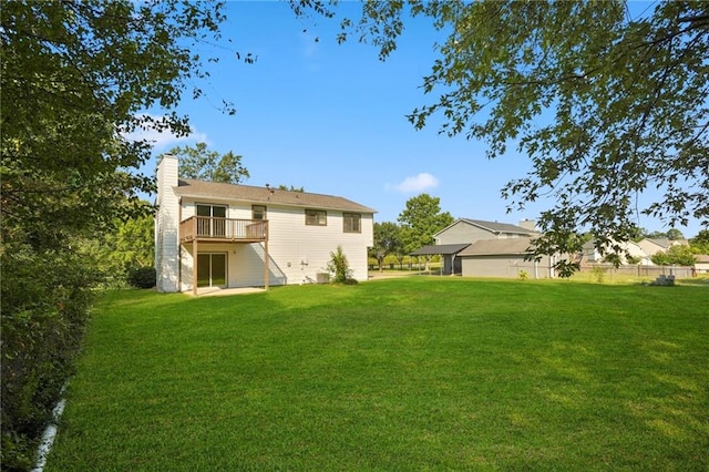 rear view of house with a lawn