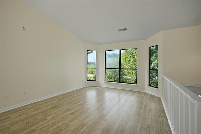 spare room featuring light wood-type flooring