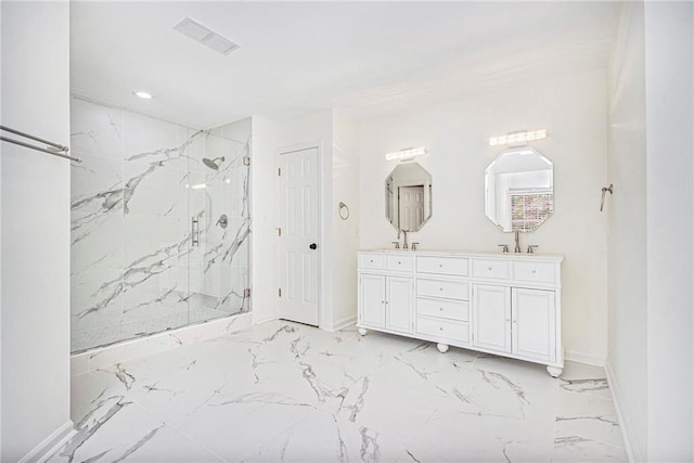 full bathroom featuring baseboards, marble finish flooring, a marble finish shower, double vanity, and recessed lighting