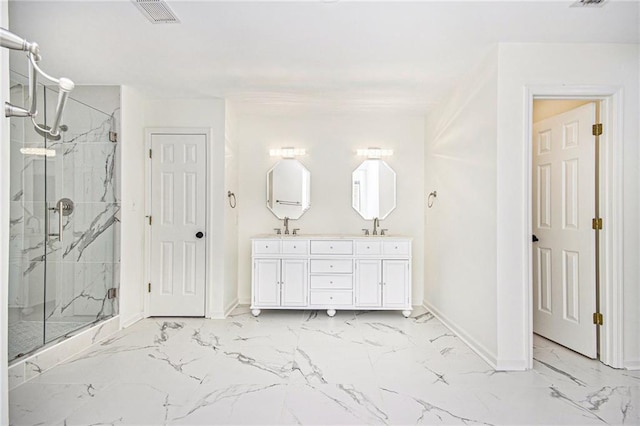 bathroom with marble look tiles, baseboards, a marble finish shower, and double vanity