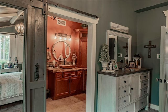 bathroom featuring vanity, lofted ceiling with beams, and tile patterned floors