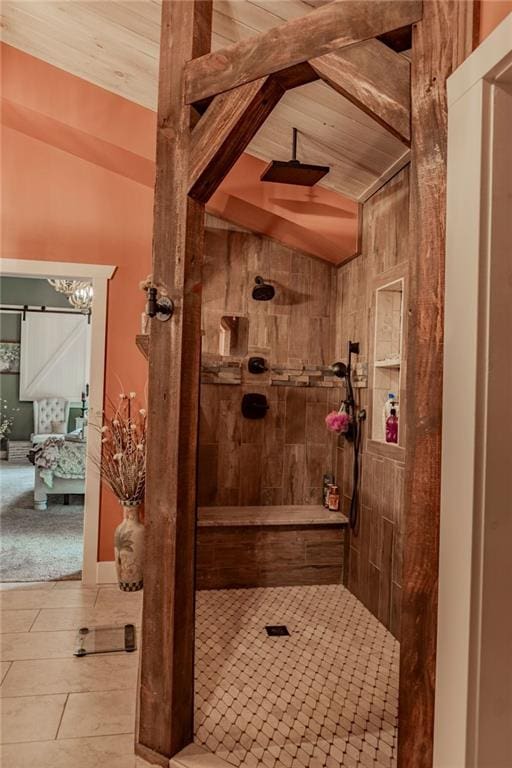 bathroom featuring wood ceiling, tiled shower, tile patterned flooring, and vaulted ceiling