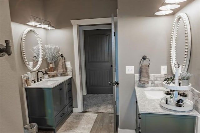 bathroom featuring vanity and hardwood / wood-style floors