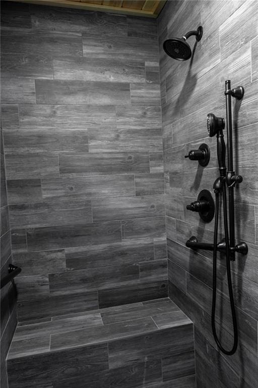 bathroom with tiled shower