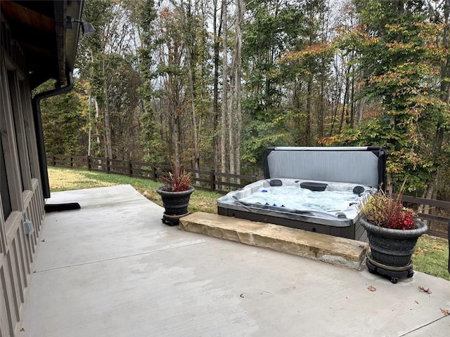 view of patio with a covered hot tub