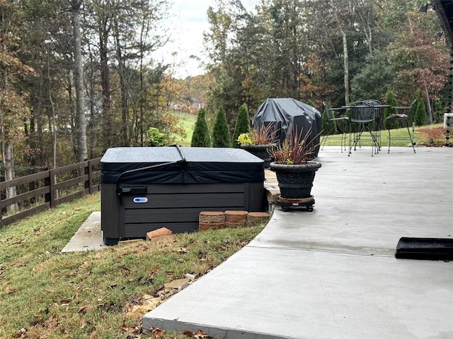 exterior space featuring a hot tub and area for grilling