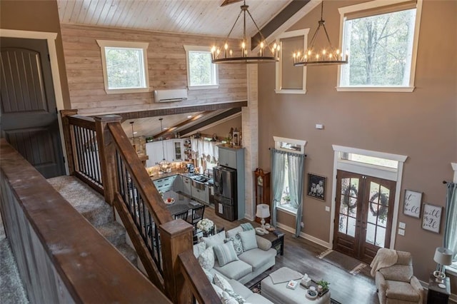 living room with wood walls, french doors, wood ceiling, high vaulted ceiling, and dark hardwood / wood-style floors