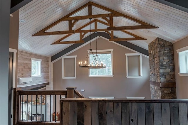 bonus room with ornate columns, lofted ceiling, and a chandelier