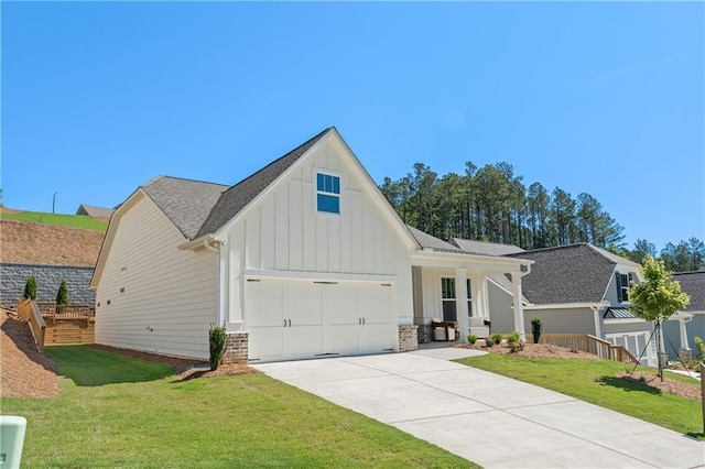 modern farmhouse style home with a garage, concrete driveway, a front lawn, board and batten siding, and brick siding