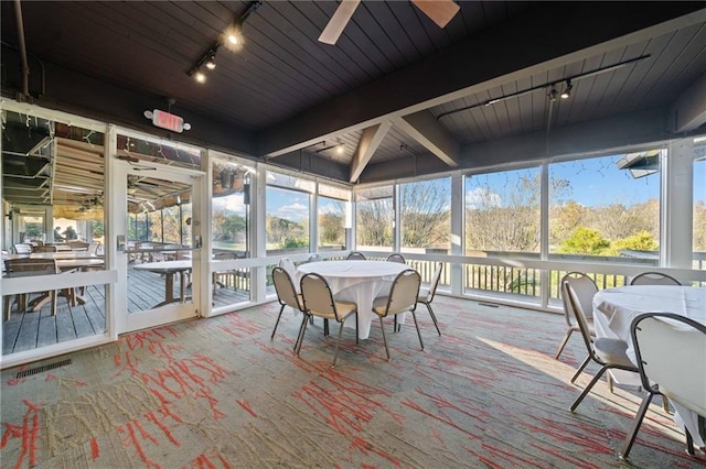 sunroom / solarium featuring a ceiling fan, visible vents, and track lighting