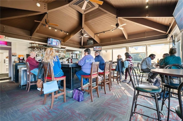 exterior space featuring carpet floors, wood ceiling, and beamed ceiling