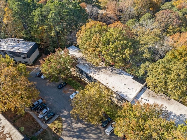 bird's eye view featuring a wooded view