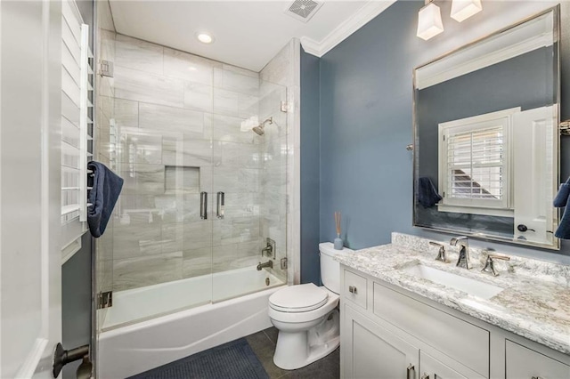 full bath featuring visible vents, crown molding, toilet, enclosed tub / shower combo, and vanity