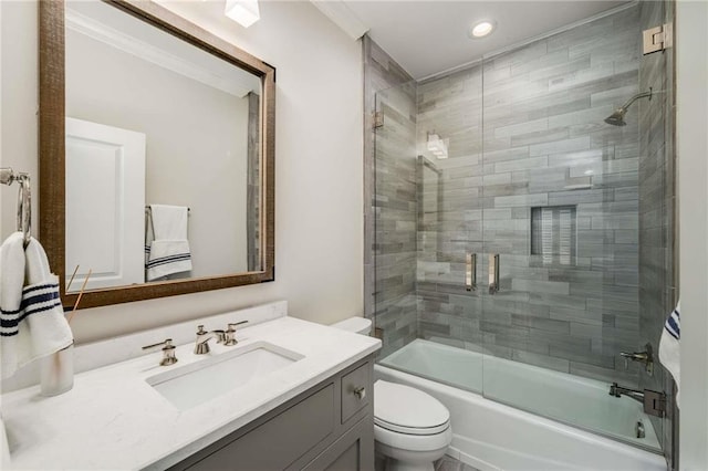 full bathroom featuring vanity, toilet, and enclosed tub / shower combo