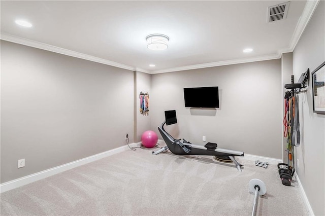 exercise area featuring crown molding, baseboards, and visible vents