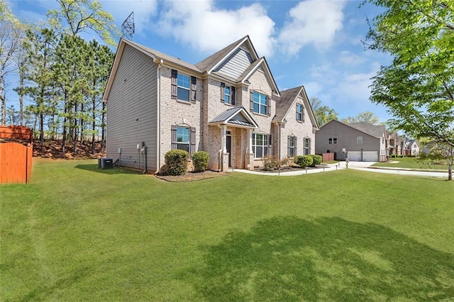 craftsman-style house featuring a front yard, brick siding, and an attached garage