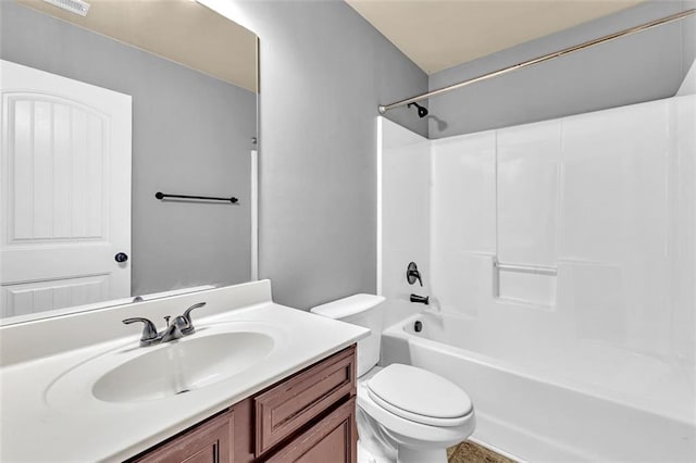 bathroom featuring vanity, shower / tub combination, and toilet