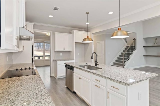 kitchen with sink, white cabinetry, hanging light fixtures, an island with sink, and stainless steel dishwasher