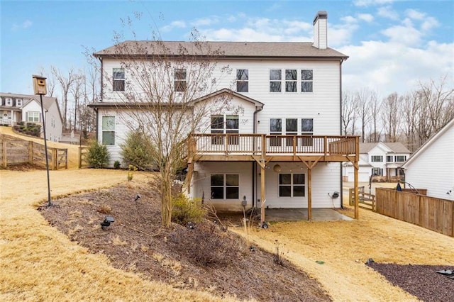 rear view of house with a wooden deck